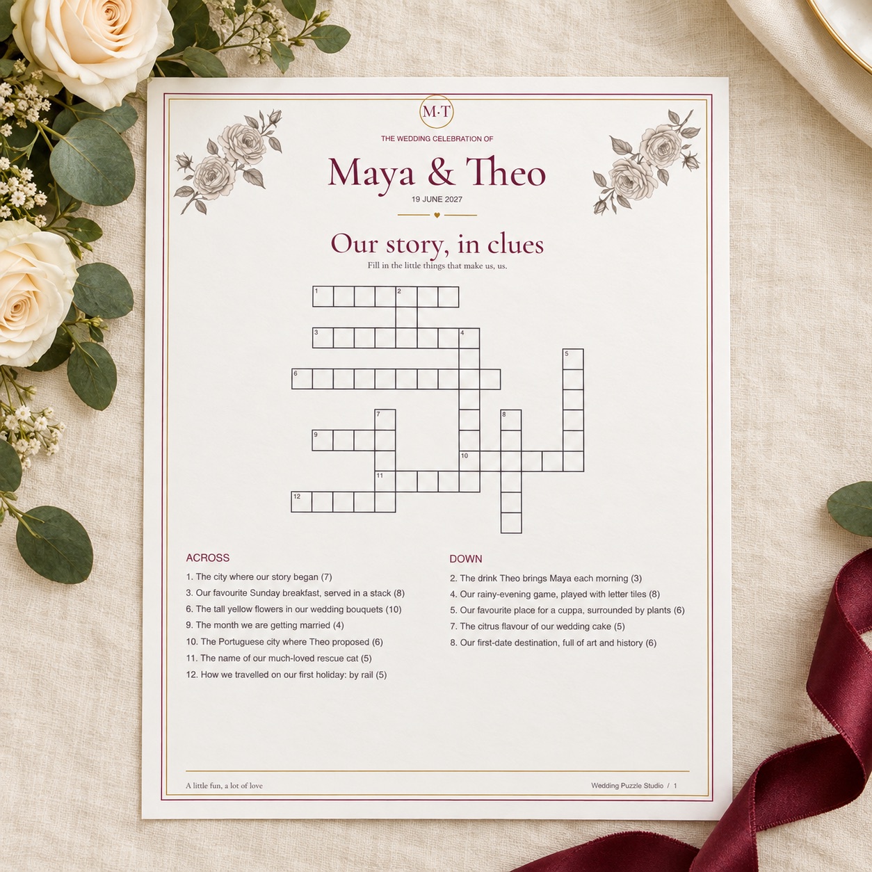 Fictional Maya and Theo personalised wedding crossword, styled with roses and claret ribbon.