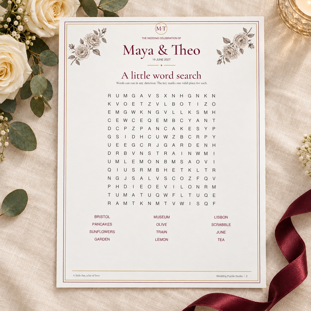 Fictional Maya and Theo personalised wedding word search, styled with roses and claret ribbon.